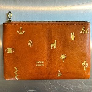 Madewell saddle and gold zip pouch. Tag on.